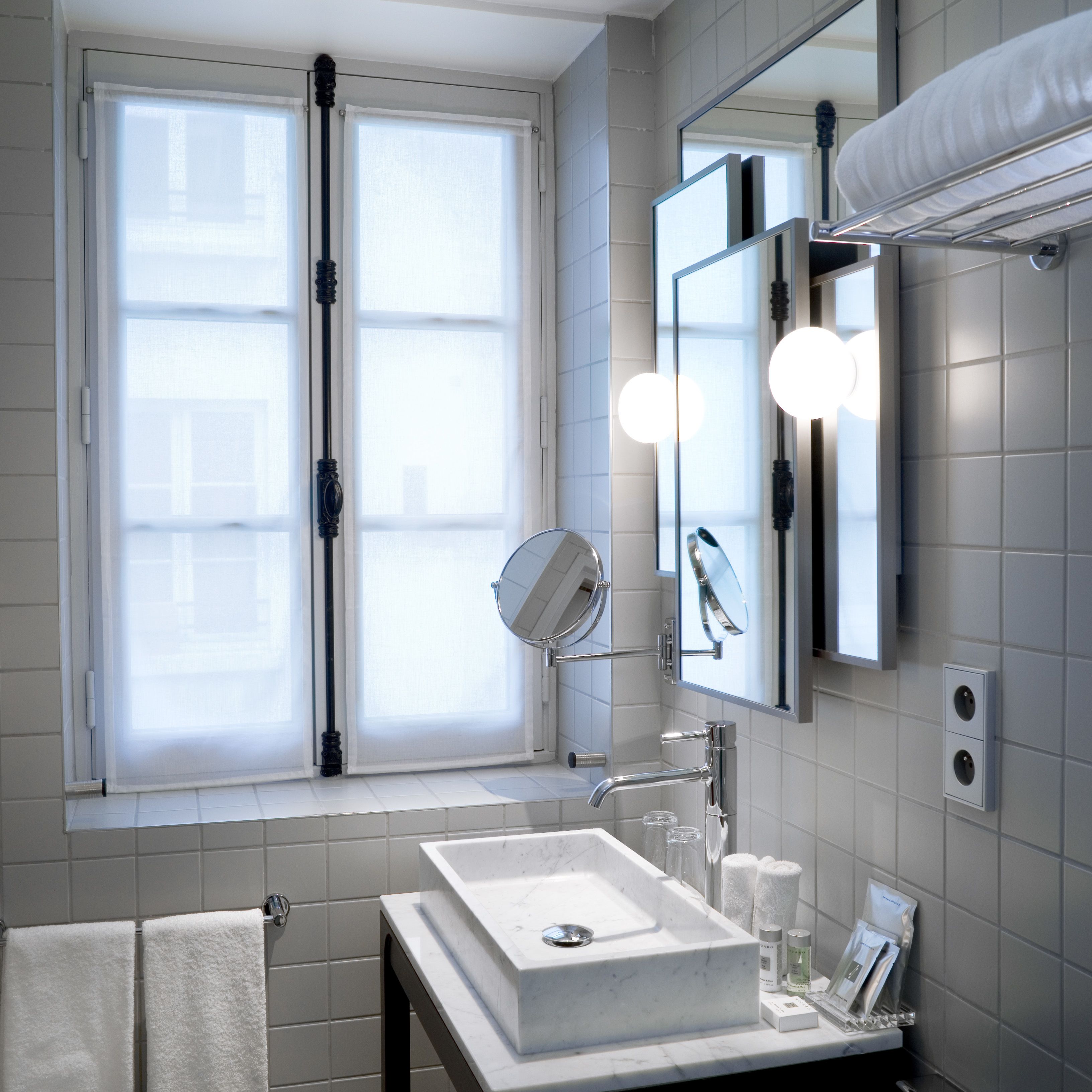deluxe room | bathroom | shower, rainfall showerhead, designer toiletries, hair dryer