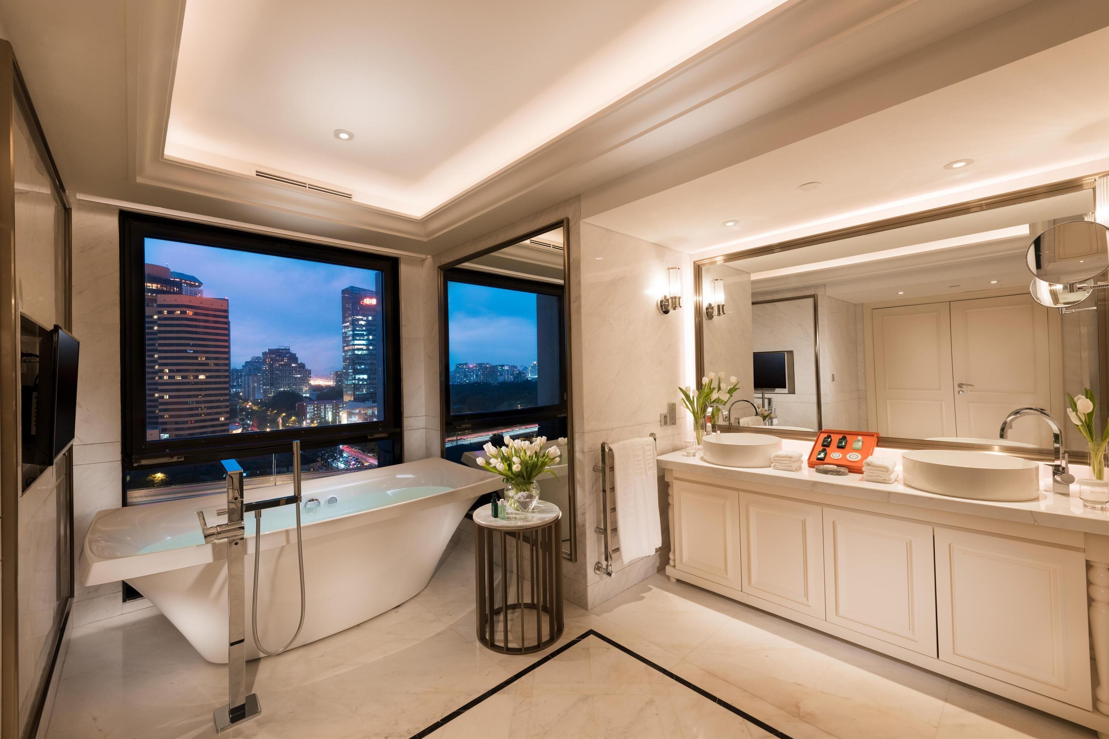 separate bathtub and shower, deep-soaking bathtub, rainfall showerhead