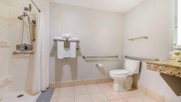 Standard Room, 1 King Bed, Accessible, Balcony (Larger Room) | Bathroom | Combined shower/bathtub, eco-friendly toiletries, hair dryer, towels