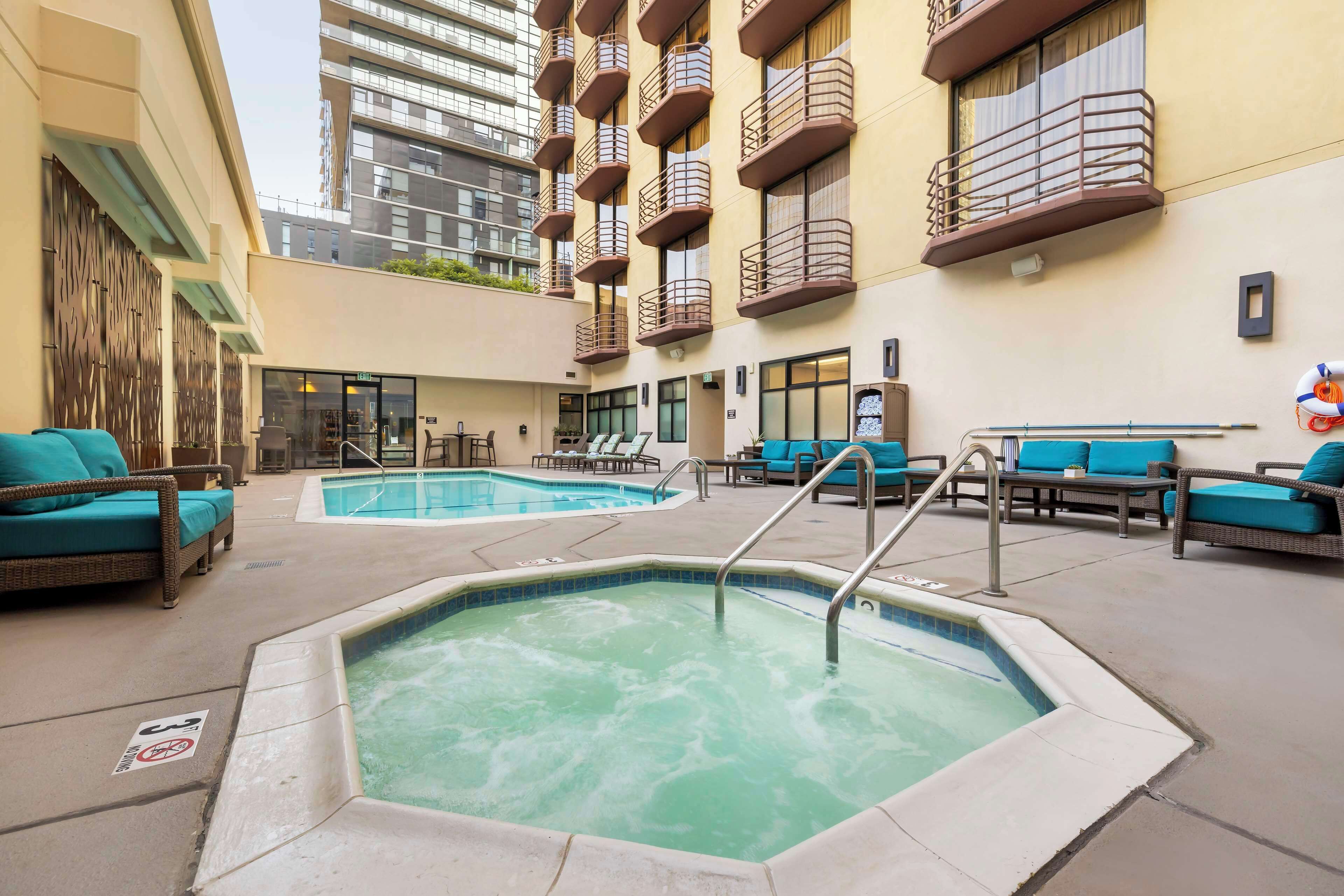 Outdoor pool, open 7:00 AM to 10:00 PM, pool loungers