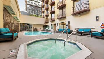 Outdoor pool, open 7:00 AM to 10:00 PM, pool loungers