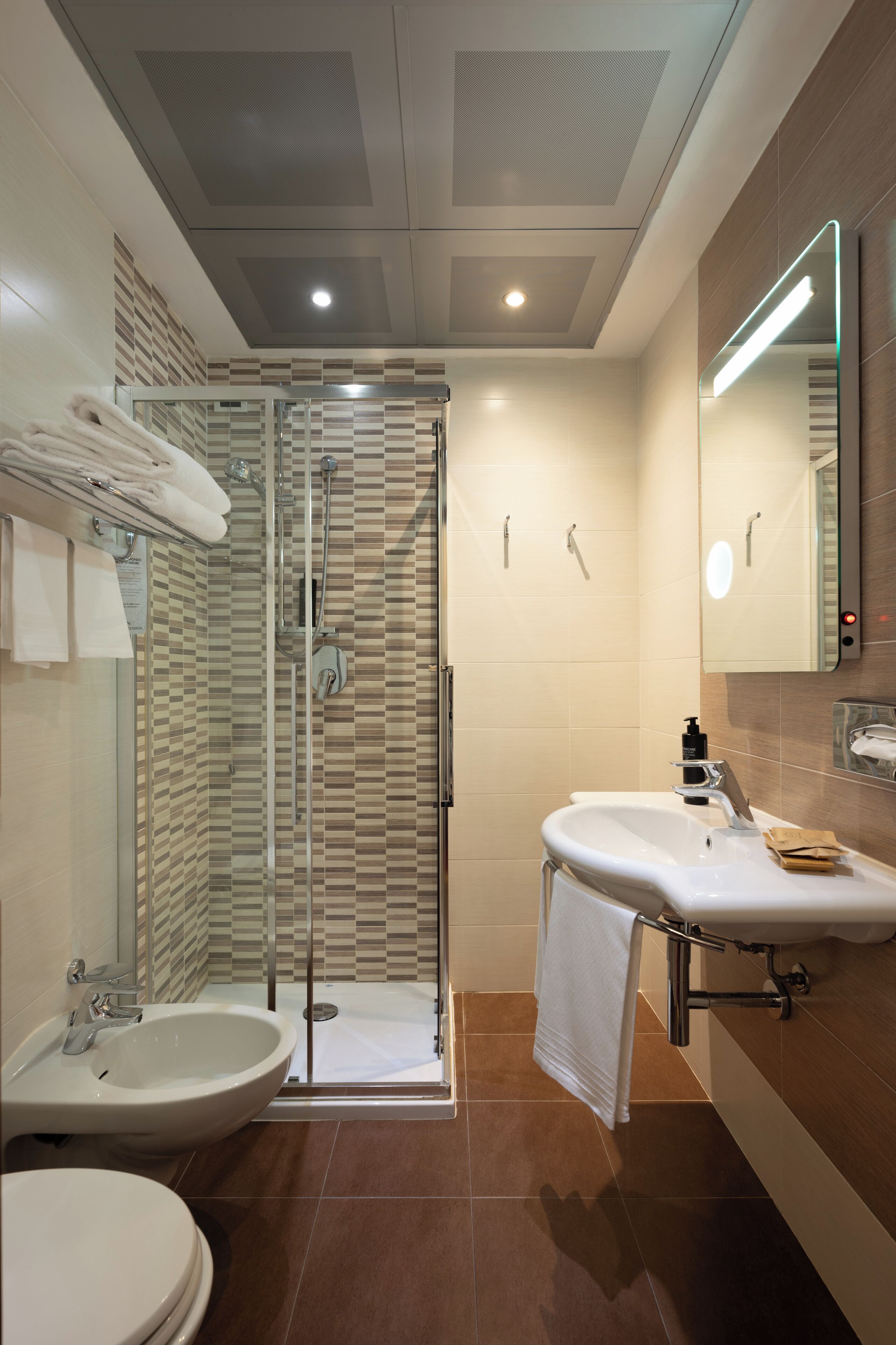 standard single room | bathroom | eco-friendly toiletries, hair dryer, bidet, towels