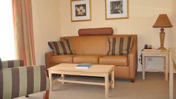 Basic Room, 1 King Bed, Garden View | Living area | 32-inch flat-screen TV with cable channels, TV