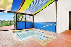Relax by the pool with a clear view of the surrounding landscape.