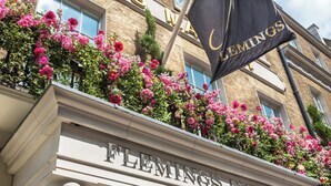 A building facade with the name "Flemings Mayfair" prominently displayed.