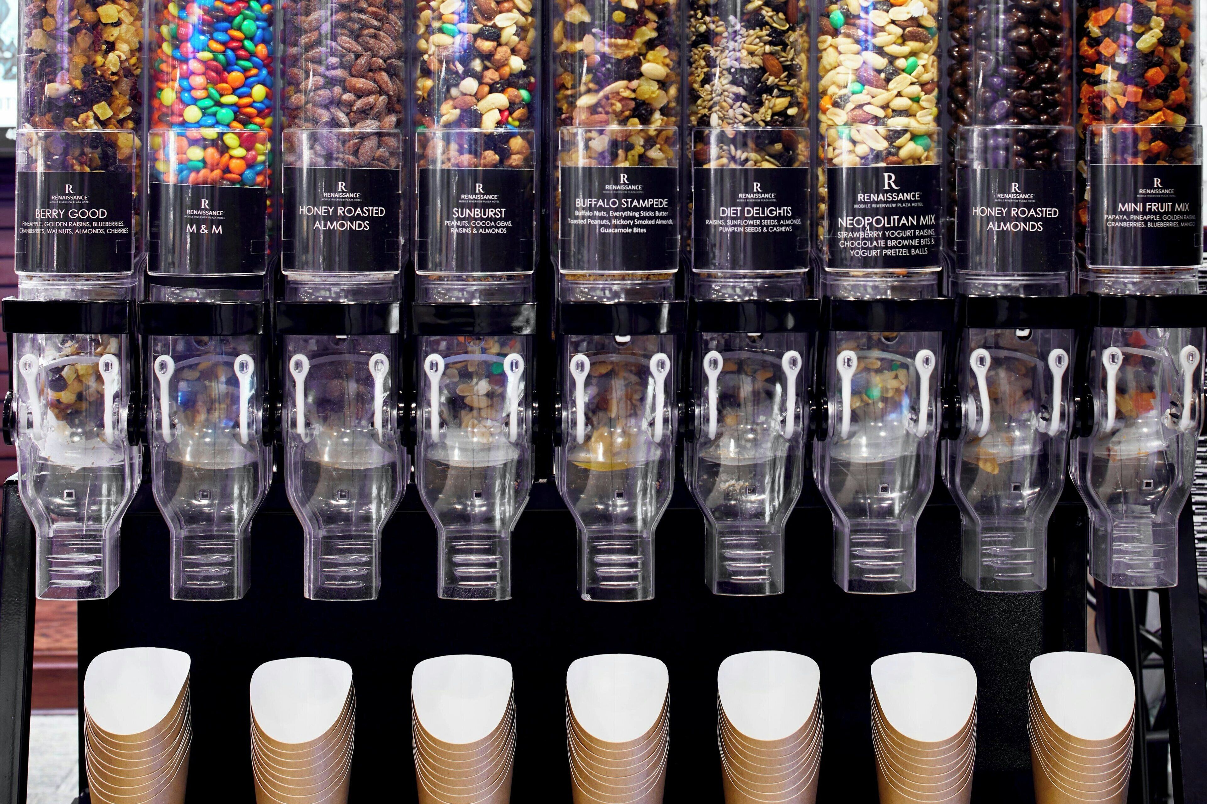 A display of assorted snack bars and their containers.