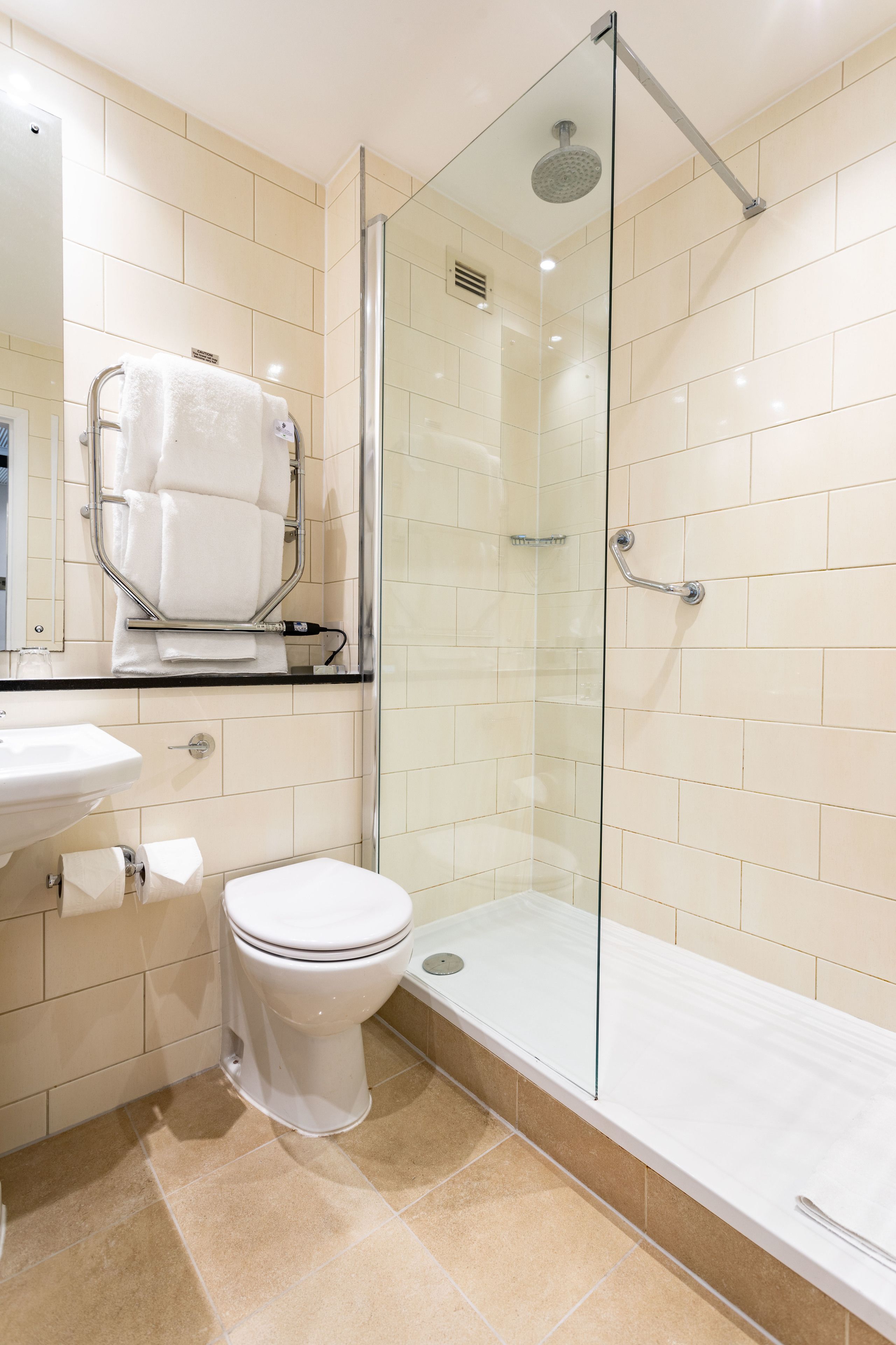 classic twin room | bathroom | eco-friendly toiletries, hair dryer, towels