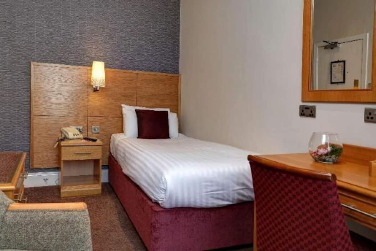 Hypo-allergenic bedding, desk, laptop workspace, blackout curtains