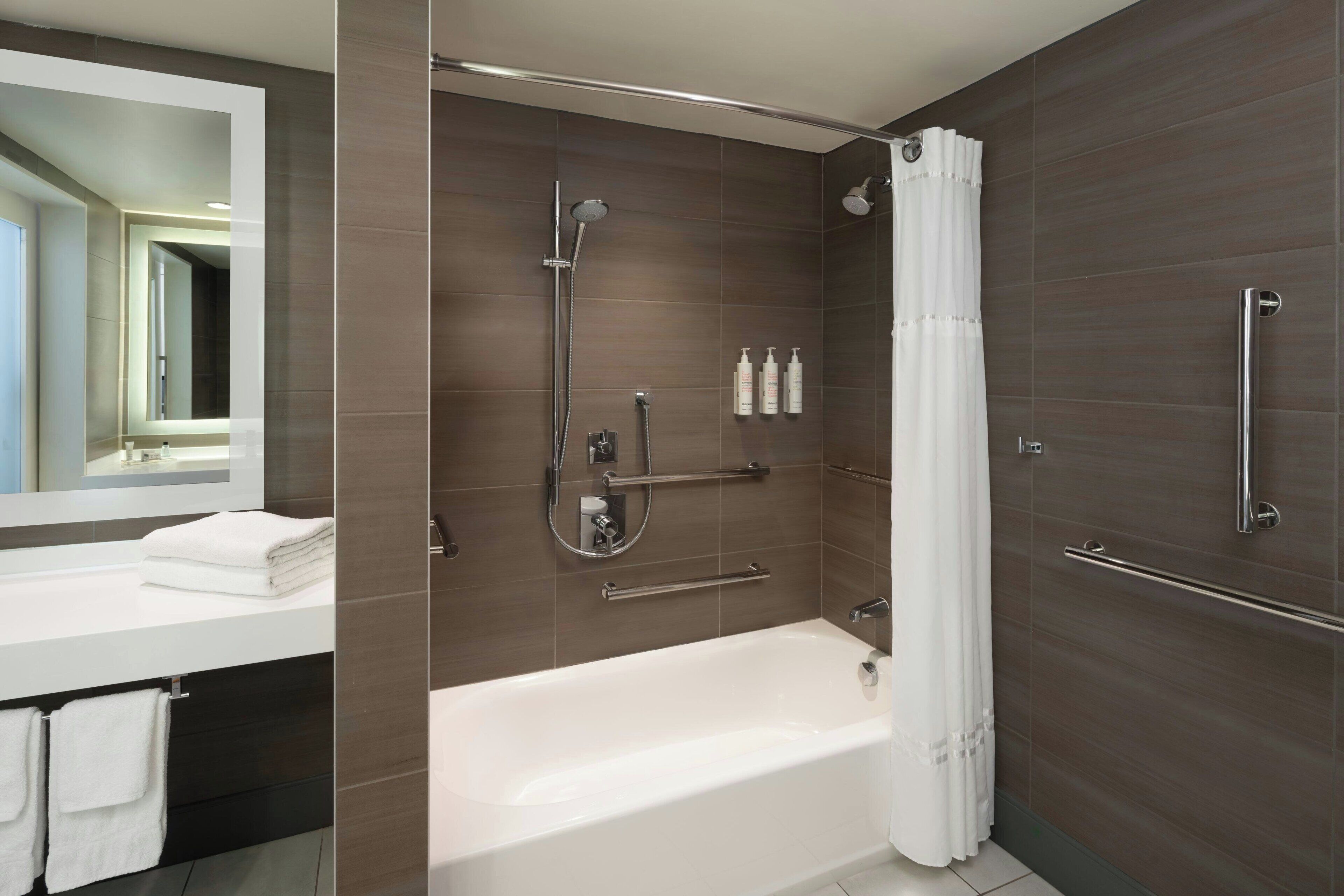 combined shower/bathtub, eco-friendly toiletries, hair dryer, towels