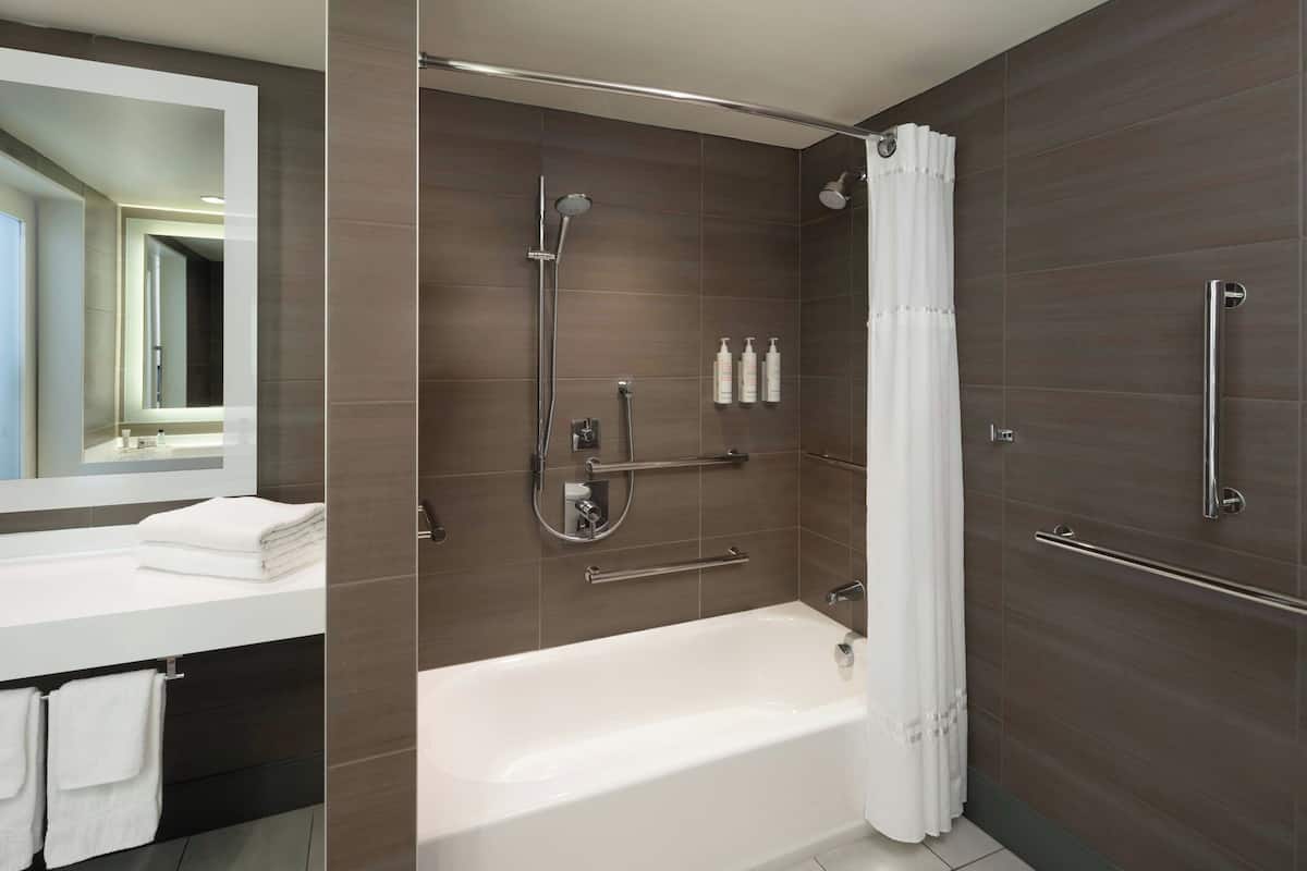 combined shower/bathtub, eco-friendly toiletries, hair dryer, towels