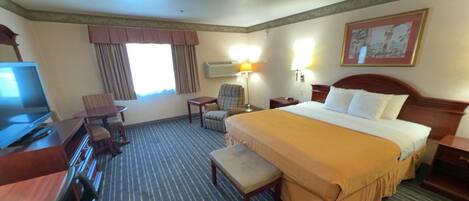 Desk, laptop workspace, blackout drapes, iron/ironing board