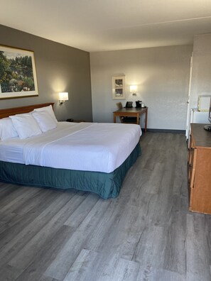Premium bedding, desk, laptop workspace, blackout curtains