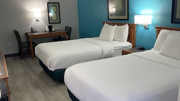 Premium bedding, desk, laptop workspace, blackout curtains