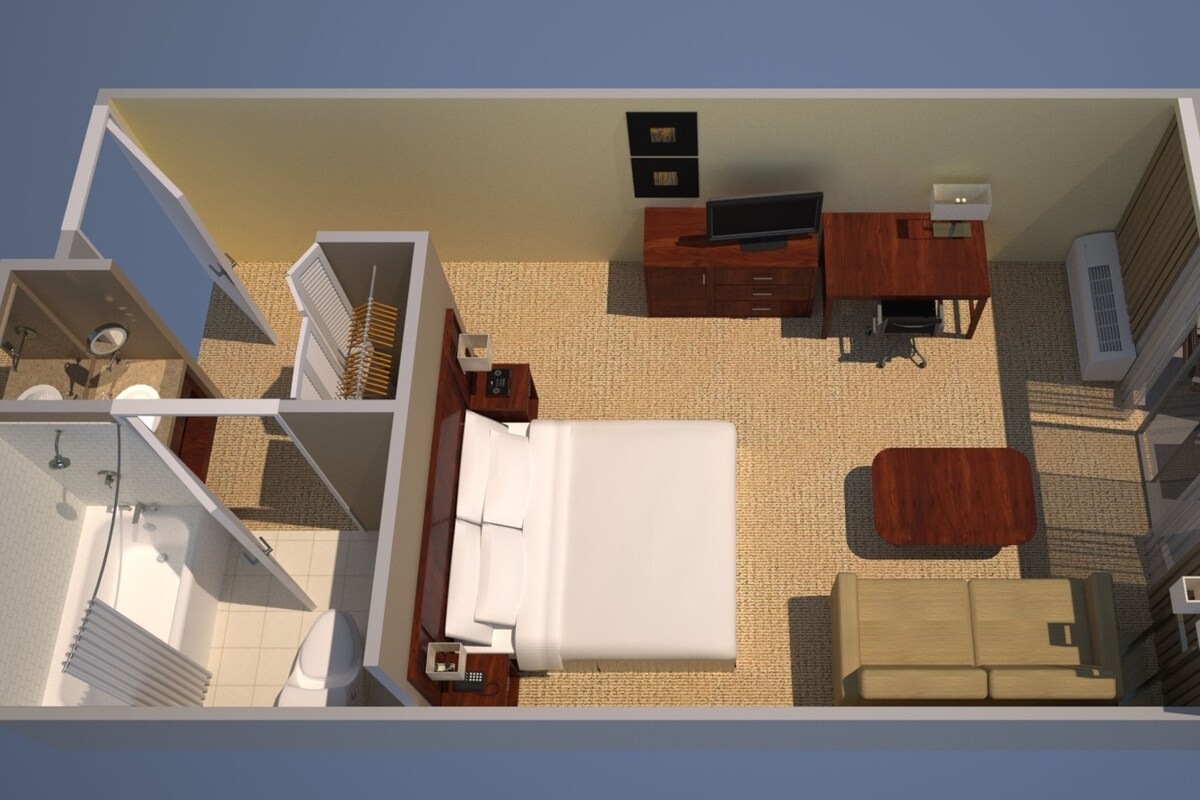A 3D floor plan of a hotel room with a bed, a desk, a TV, a wardrobe, a bathroom, and a balcony.