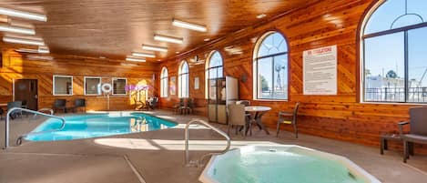 Indoor pool, open 7 AM to 11 PM, pool loungers