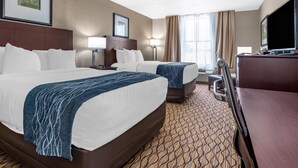 A hotel room with two beds, a desk, a TV, and a lamp. - Comfort Inn & Suites Glen Mills - West Chester (Glen Mills)
