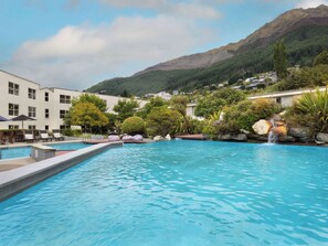 Outdoor pool, open 7:00 AM to 10:00 PM, pool umbrellas, pool loungers