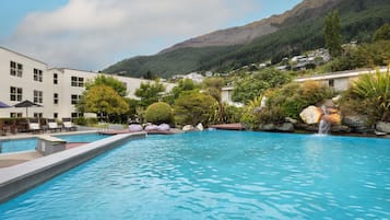 Outdoor pool, open 7:00 AM to 10:00 PM, pool umbrellas, sun loungers