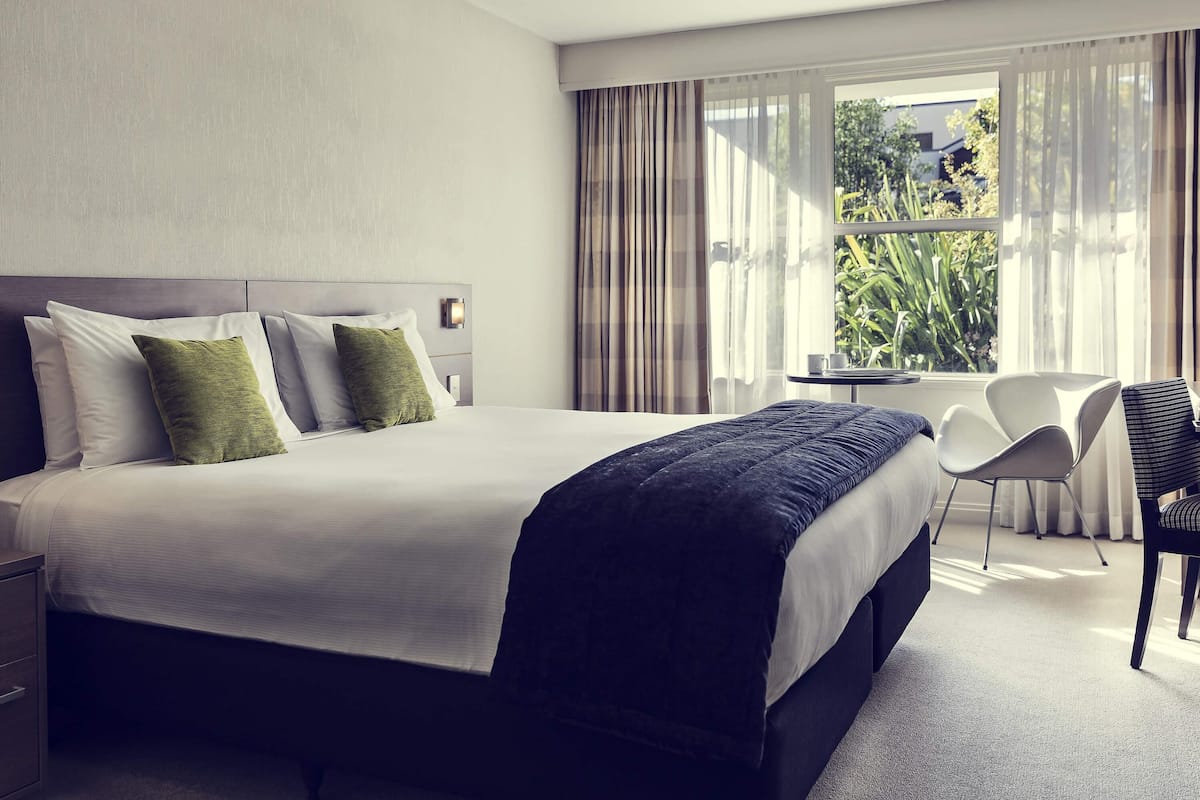 Room, 1 King Bed, Garden View | In-room safe, individually furnished, desk, blackout drapes