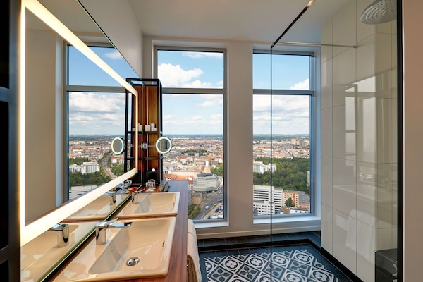 Eco-friendly toiletries, hair dryer, towels, toilet paper