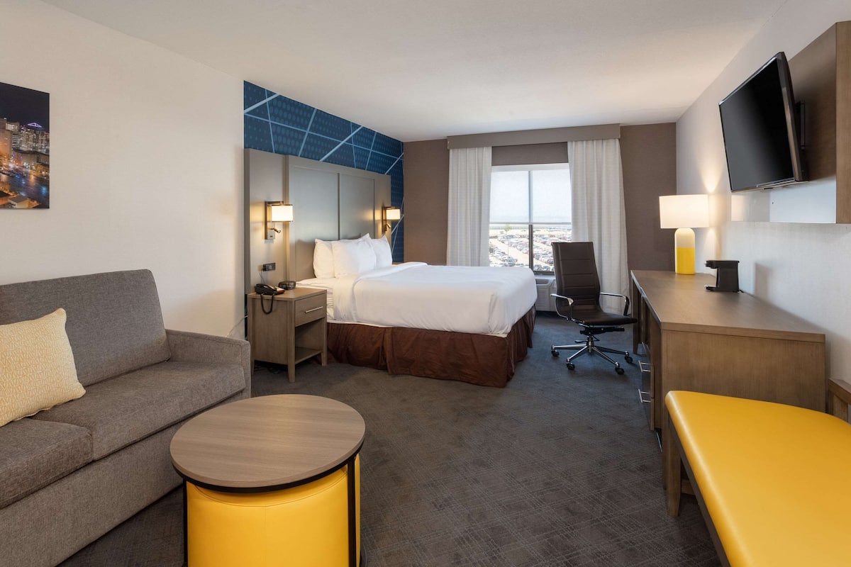 suite, 1 king bed with sofa bed, non smoking | desk, blackout curtains, iron/ironing board, free cots/infant beds