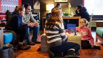 Relax in a family-friendly space with comfortable seating and a variety of games and toys.
