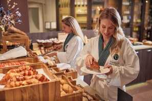 Indulge in a selection of freshly baked croissants and pastries at our buffet.