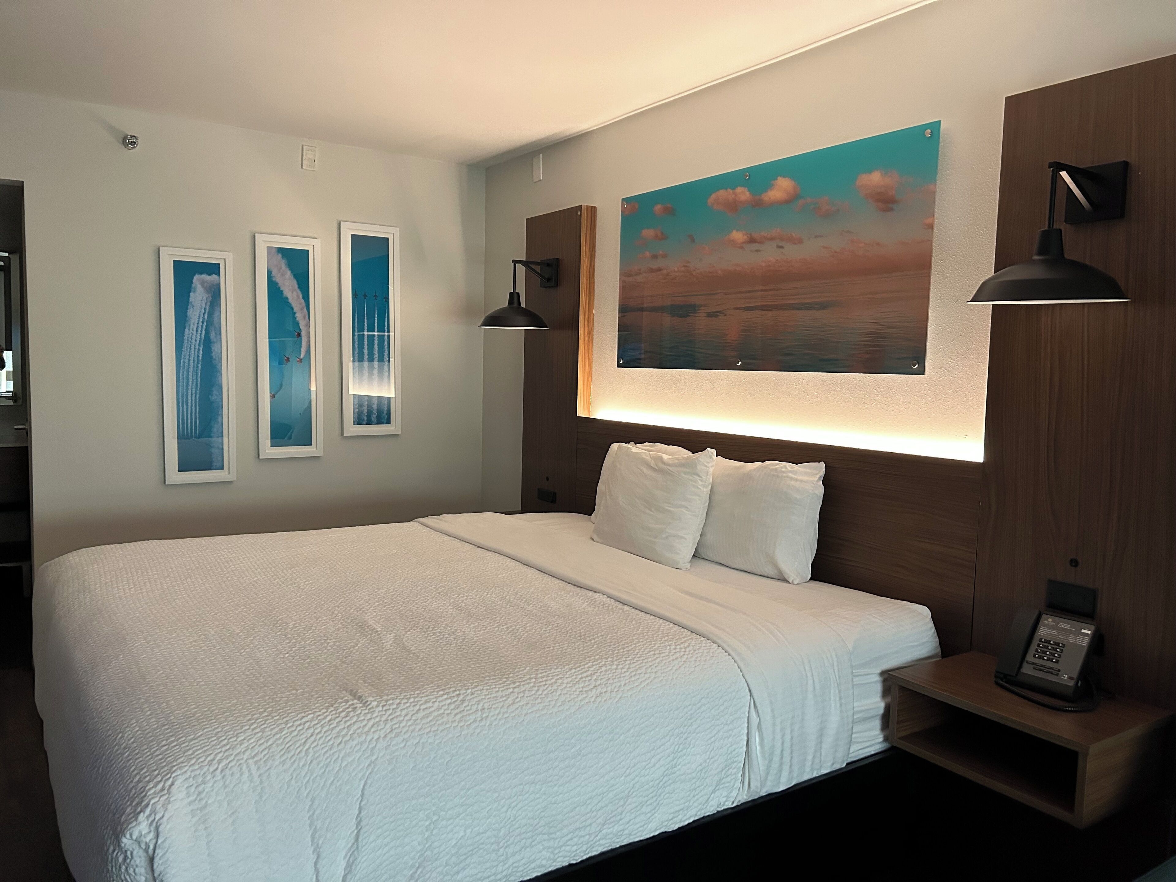 Premium bedding, desk, laptop workspace, iron/ironing board