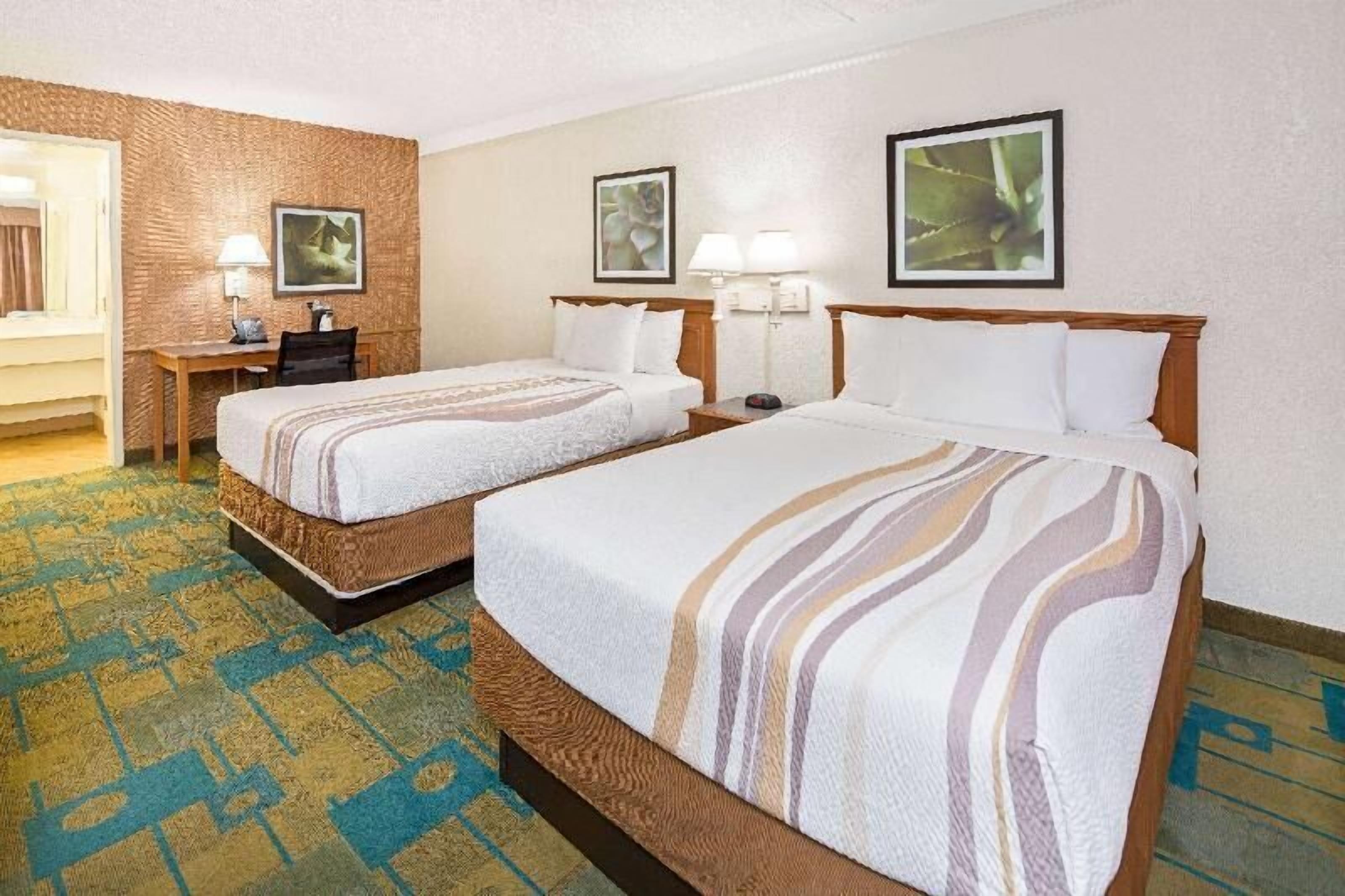Premium bedding, desk, laptop workspace, iron/ironing board