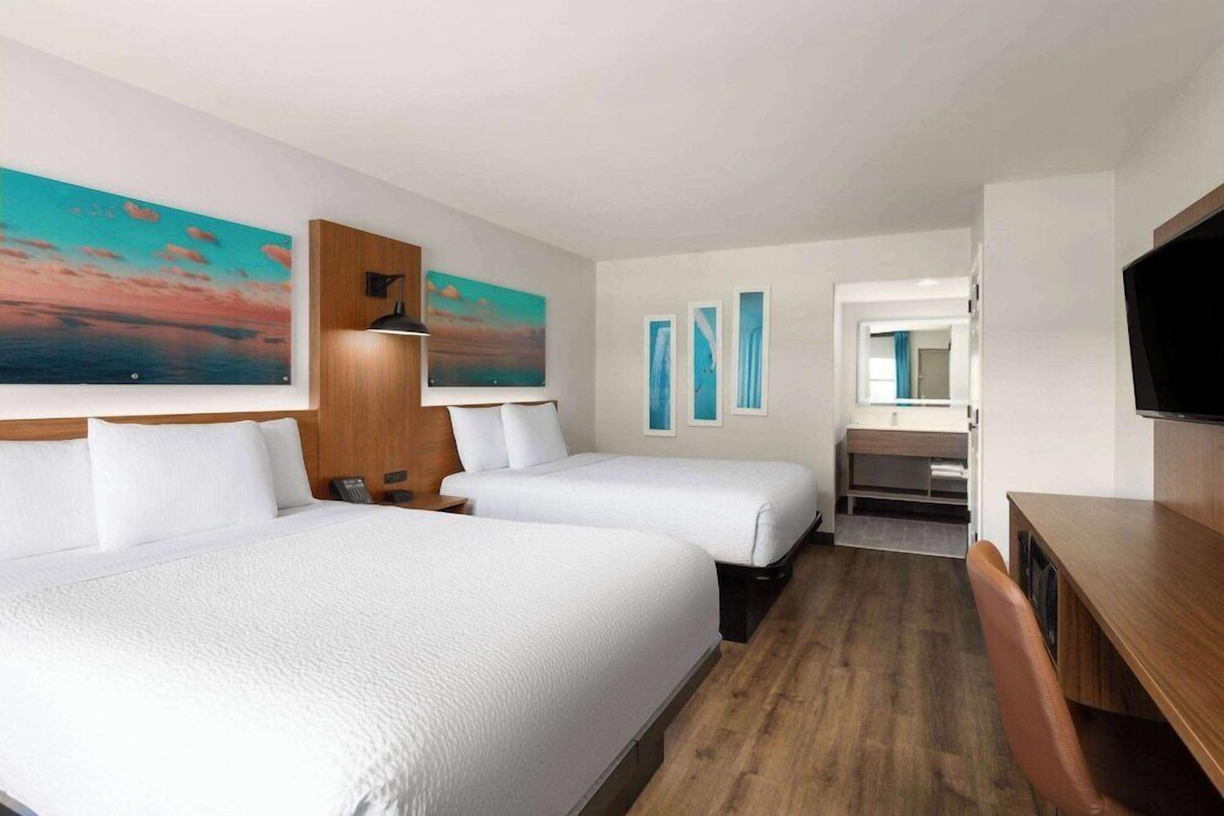 Premium bedding, desk, laptop workspace, iron/ironing board