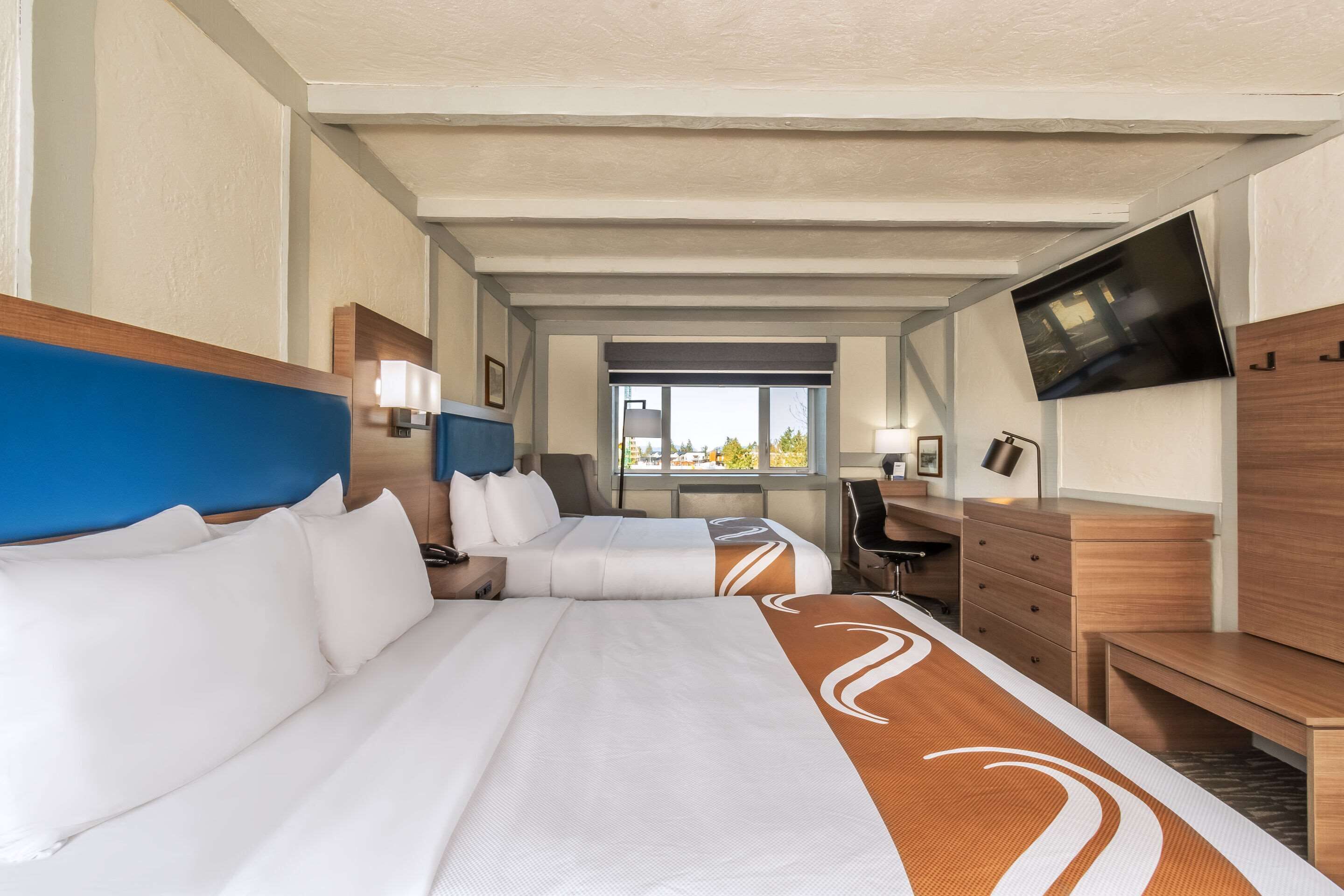 standard room, 2 queen beds, non smoking | desk, iron/ironing board, bed sheets, alarm clocks