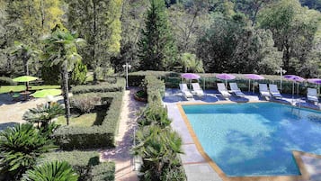 Outdoor pool, open 9:30 AM to 7:30 PM, pool loungers