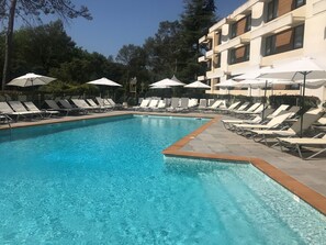 Outdoor pool, open 9:30 AM to 7:30 PM, pool loungers