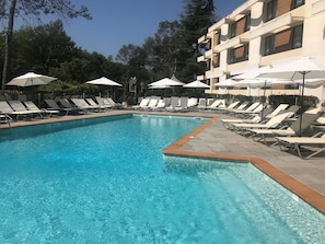 Outdoor pool, open 9:30 AM to 7:30 PM, pool loungers