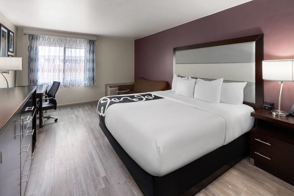 Premium bedding, desk, blackout drapes, iron/ironing board