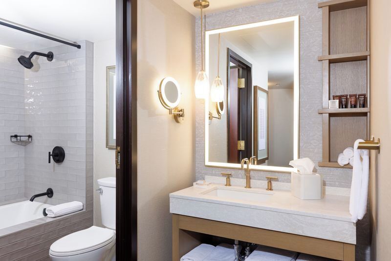 Signature Suite, 1 King Bed, Non Smoking | Bathroom | Combined shower/tub, deep soaking tub, free toiletries, hair dryer