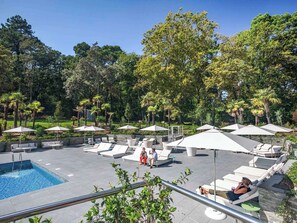Seasonal outdoor pool, pool umbrellas, pool loungers