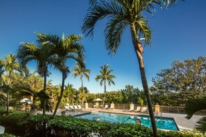 Outdoor pool, open 8 AM to 10 PM, pool loungers