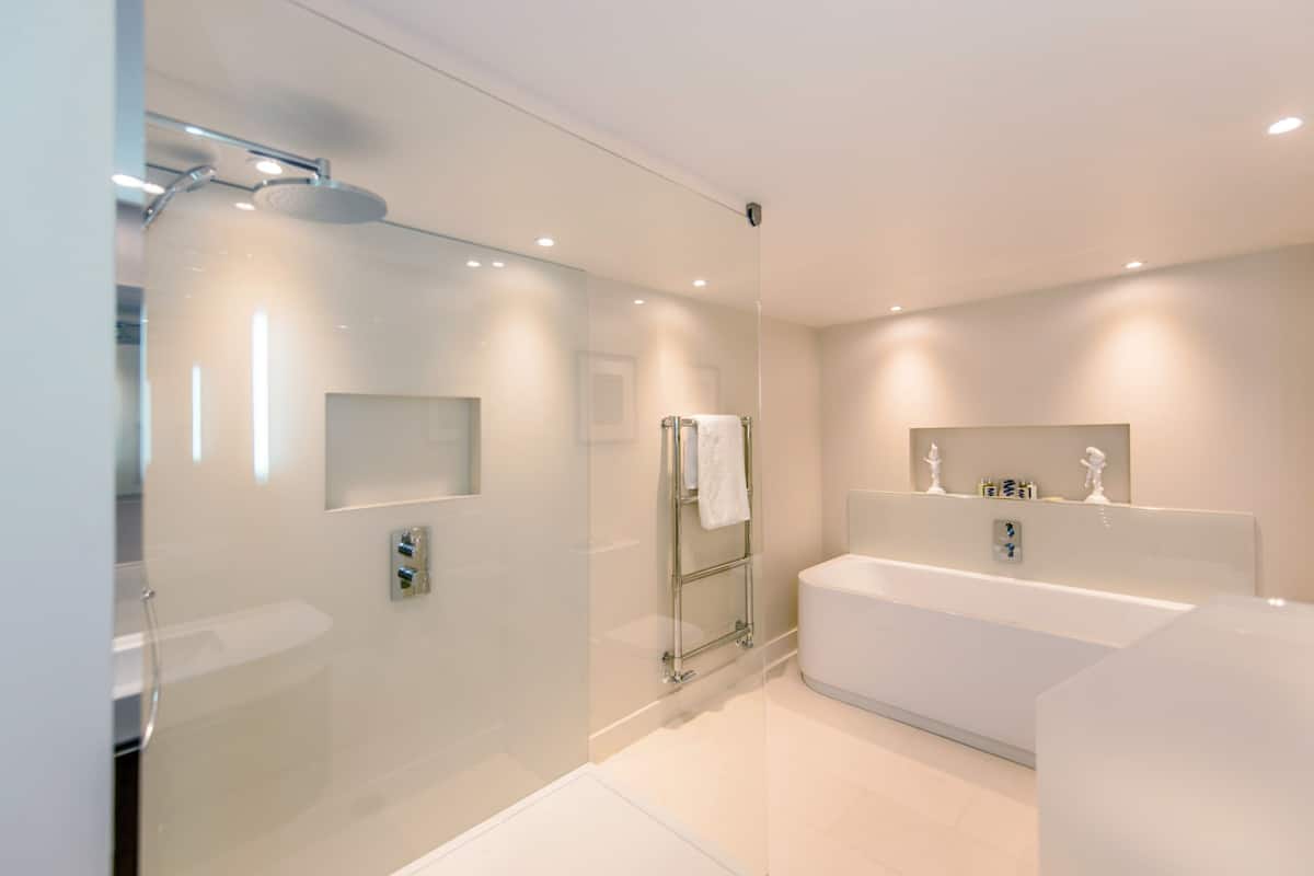 junior deluxe | bathroom | designer toiletries, hair dryer, bathrobes, towels