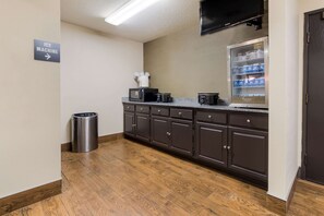 A kitchen with a microwave, coffee maker, and a refrigerator stocked with beverages. - Sleep Inn Sioux Falls Airport (Sioux Falls)