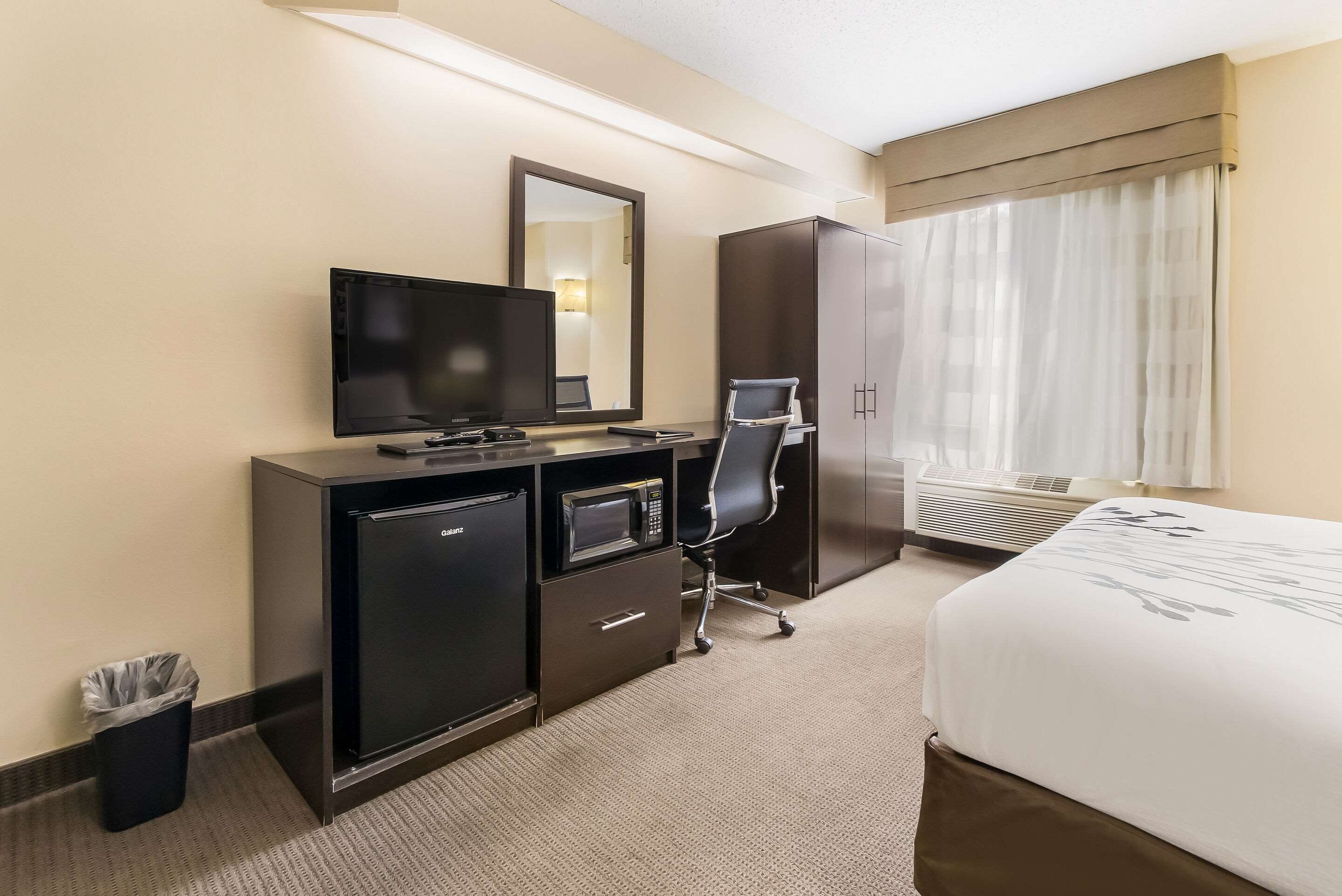 desk, blackout curtains, iron/ironing board, cots/infant beds