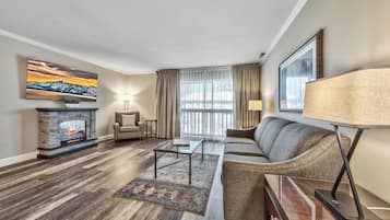 Deluxe Suite, 1 Bedroom | Living area | 60-inch flat-screen TV with cable channels, TV