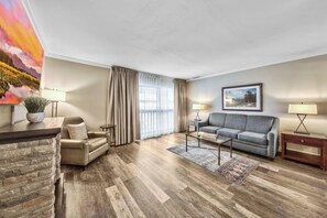 Deluxe Suite, 1 Bedroom | Living area | 60-inch flat-screen TV with cable channels, TV