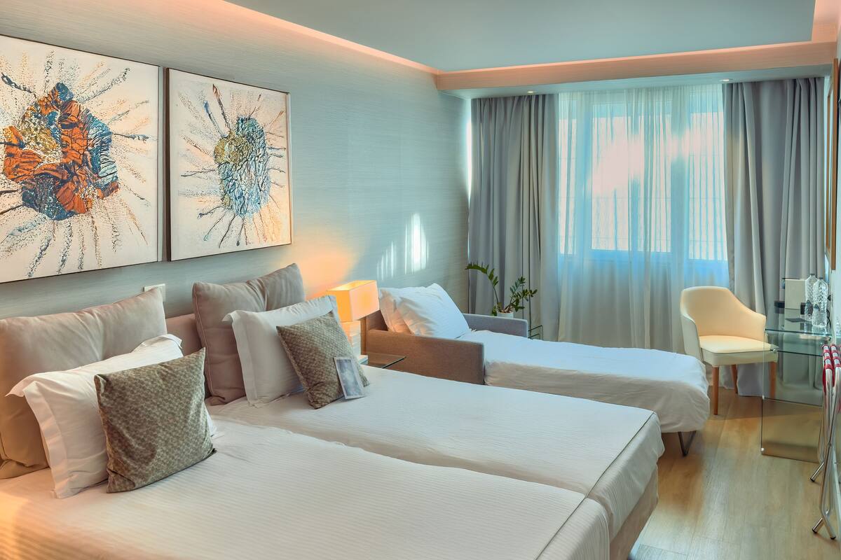 Basic Triple Room with Courtyard View | Premium bedding, minibar, in-room safe, individually decorated
