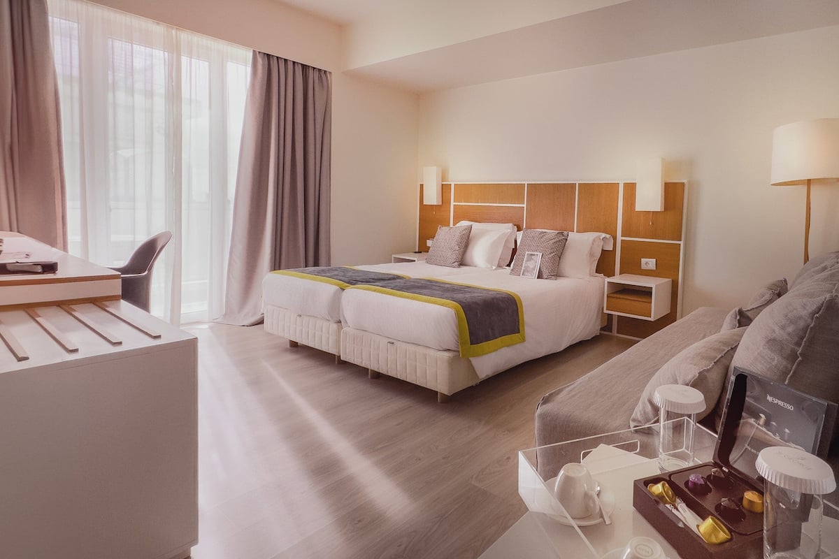 Eco Chic Double Room with Private Balcony | Premium bedding, minibar, in-room safe, individually decorated