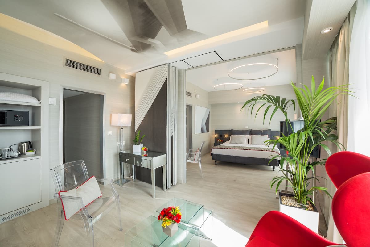 Deluxe Suite with Corner Balcony and Lycabettus Hill View | Premium bedding, minibar, in-room safe, individually decorated