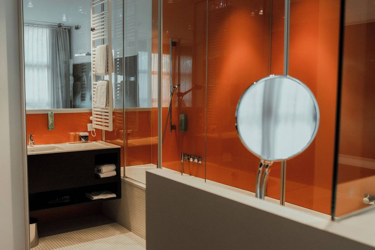 studio suite, 1 king bed, bathtub, park view | bathroom | separate bathtub and shower, rainfall showerhead, designer toiletries