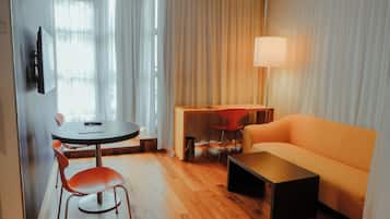 Studio Suite, 1 King Bed, Bathtub, Park View | Living area | Flat-screen TV, DVD player