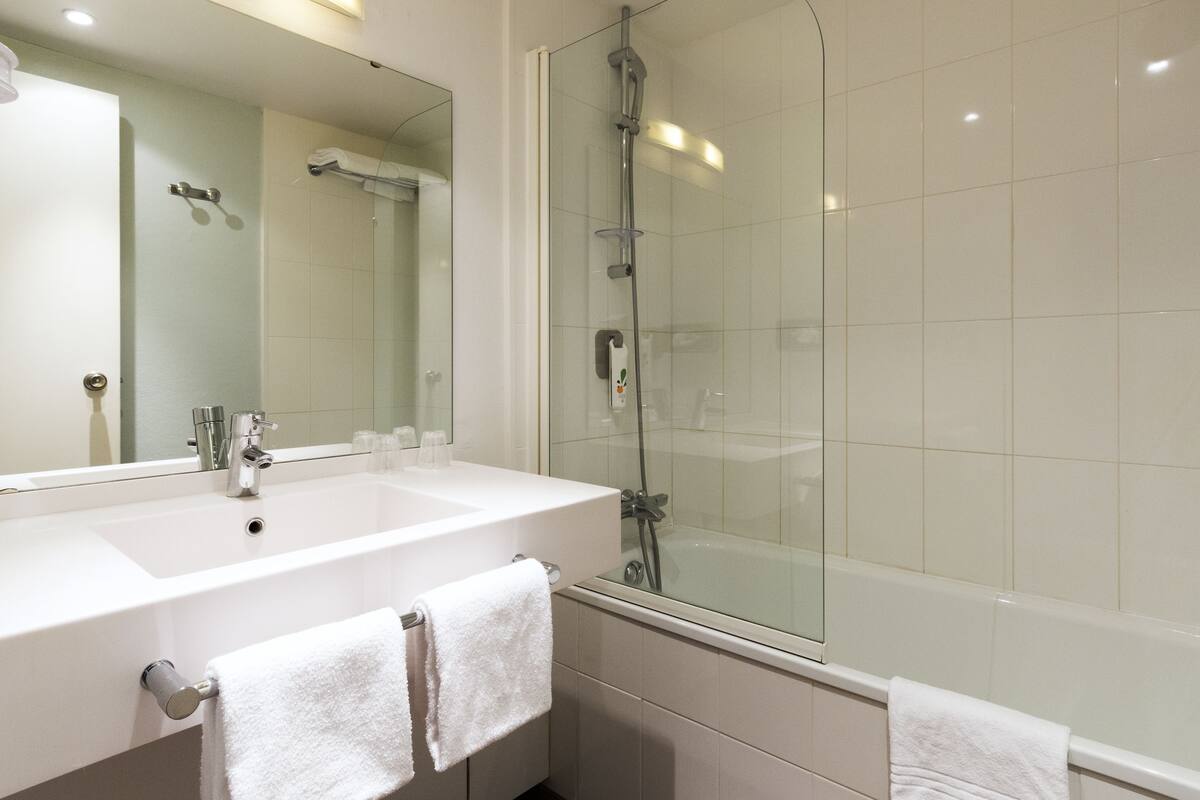 eco-friendly toiletries, hair dryer, towels, soap