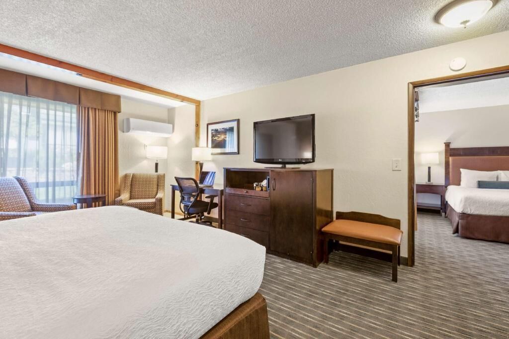 Premium bedding, pillow-top beds, desk, laptop workspace